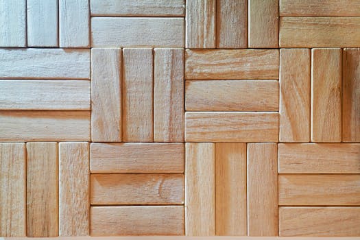 Close-up of intricately patterned wooden parquet with a natural texture and light finish.